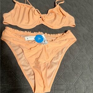Orange bikini. Size large. New with tags.
